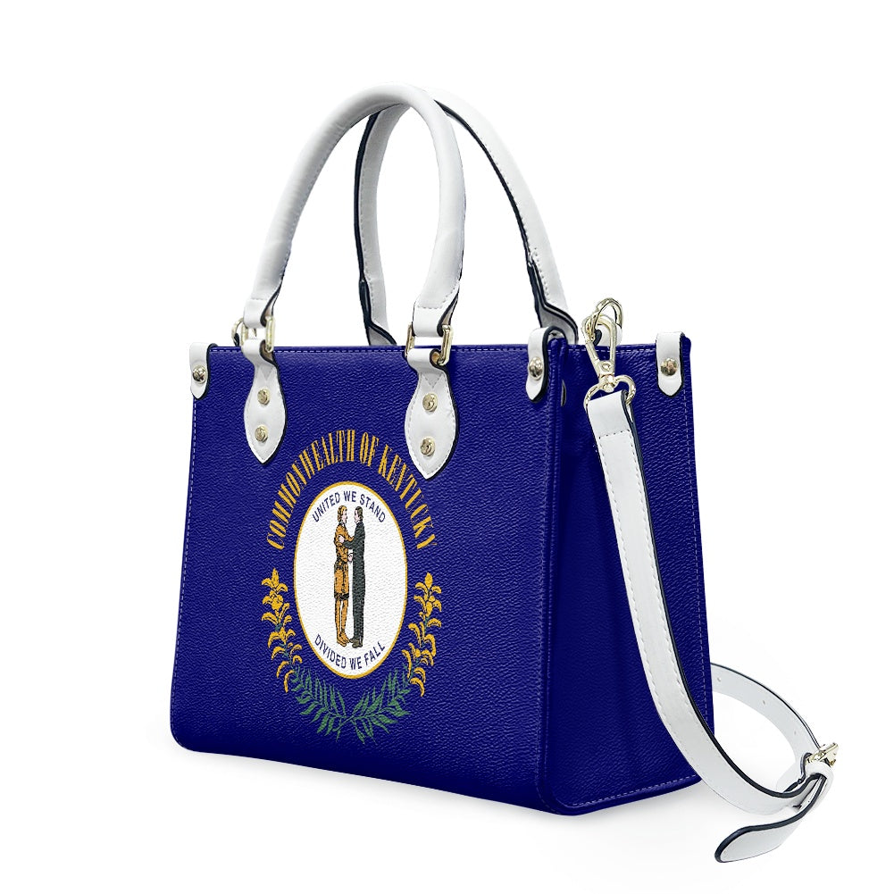 Blue handbag with Kentucky emblem, white handles, by [Brand].