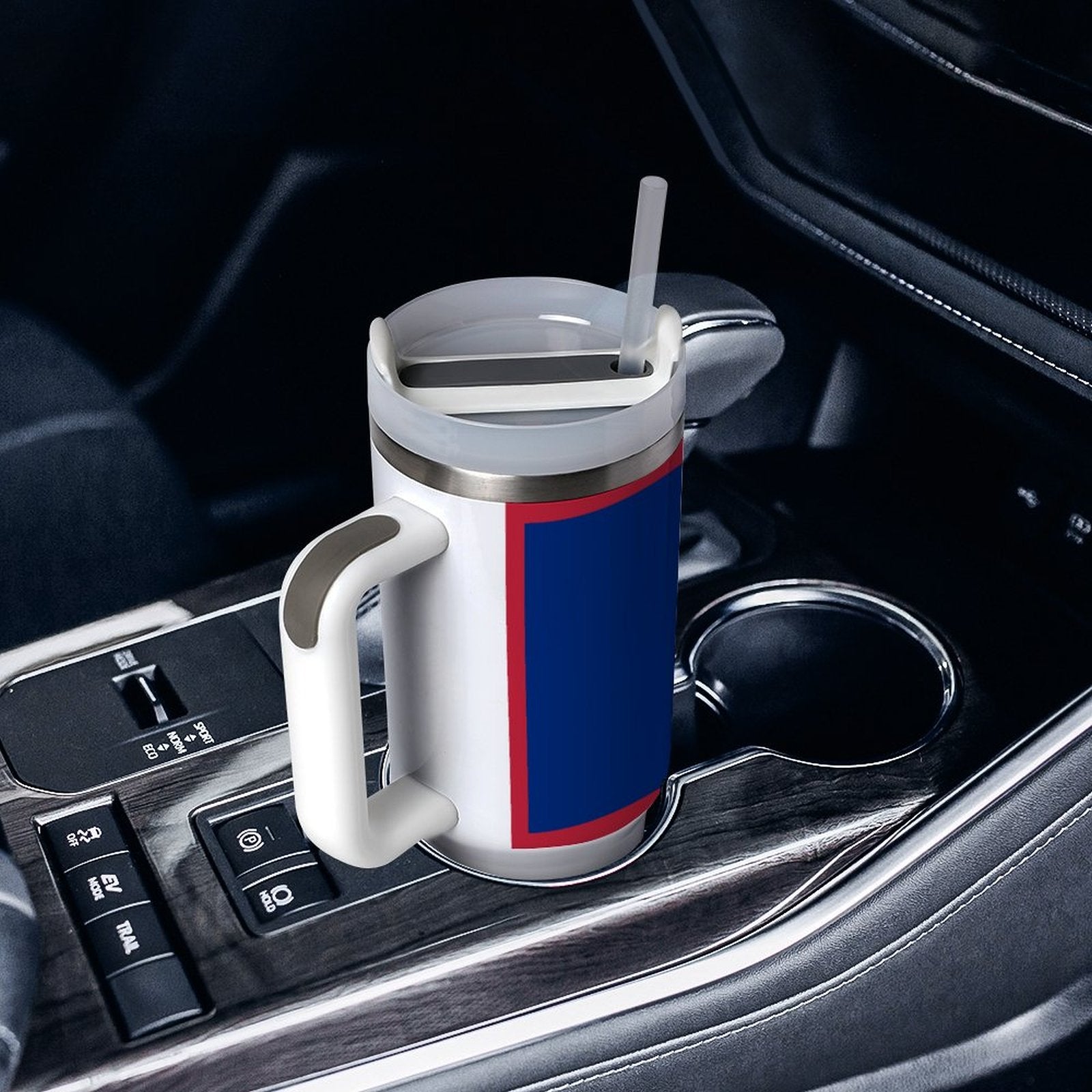 [Brand] white travel mug with straw in car holder.