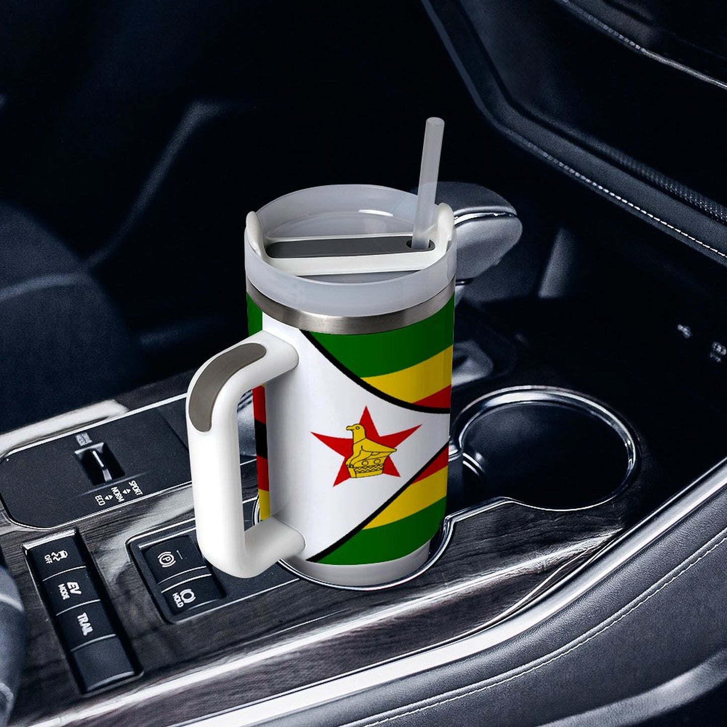 [Brand] travel mug with Zimbabwe flag in car holder.