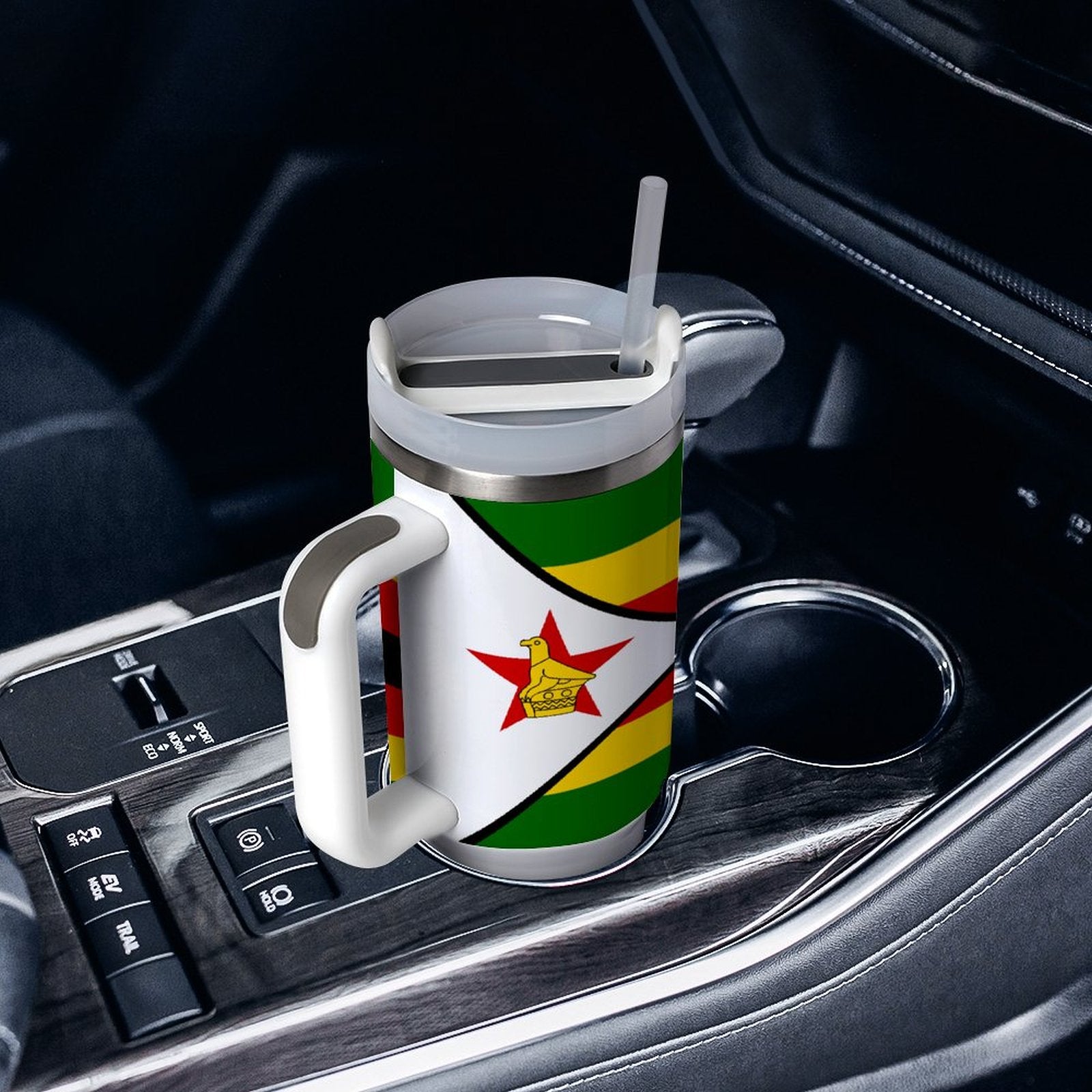 [Brand] travel mug with Zimbabwe flag in car holder.