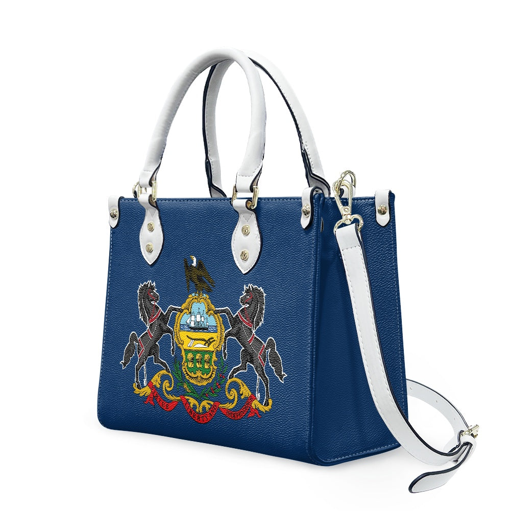 Blue handbag with state emblem and [Brand] white handles.