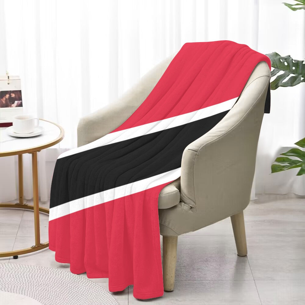 Cozy armchair with Luv My Flag striped blanket draped.