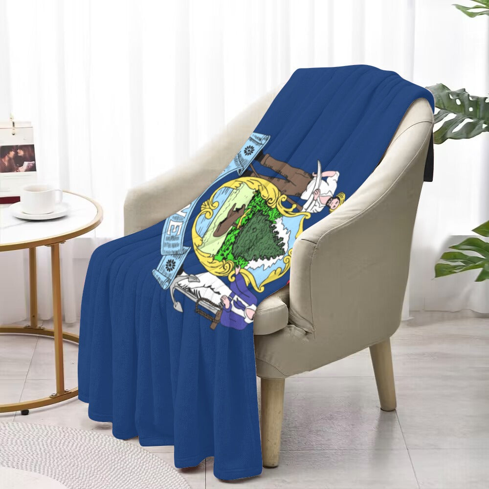 Blue chair draped with colorful Luv My Flag blanket.