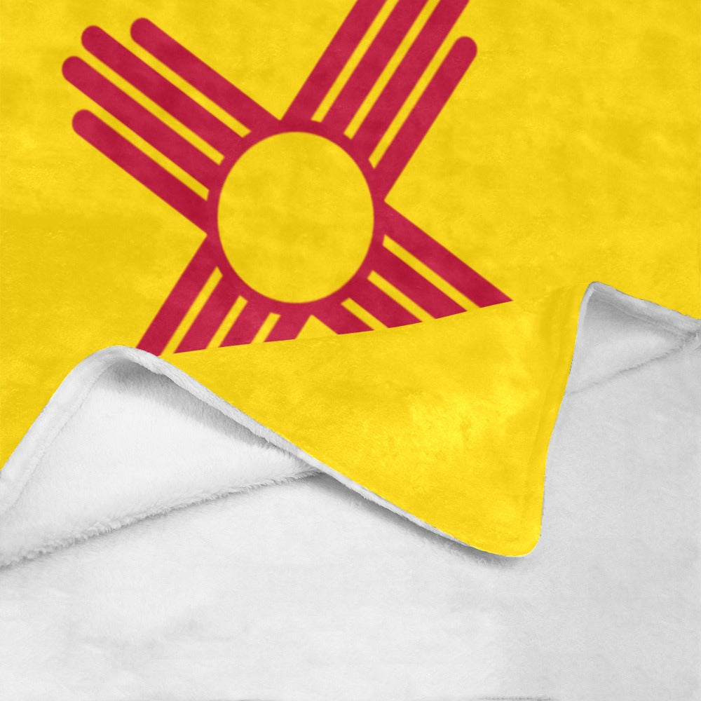 Yellow blanket featuring red sun symbol, Luv My Flag.