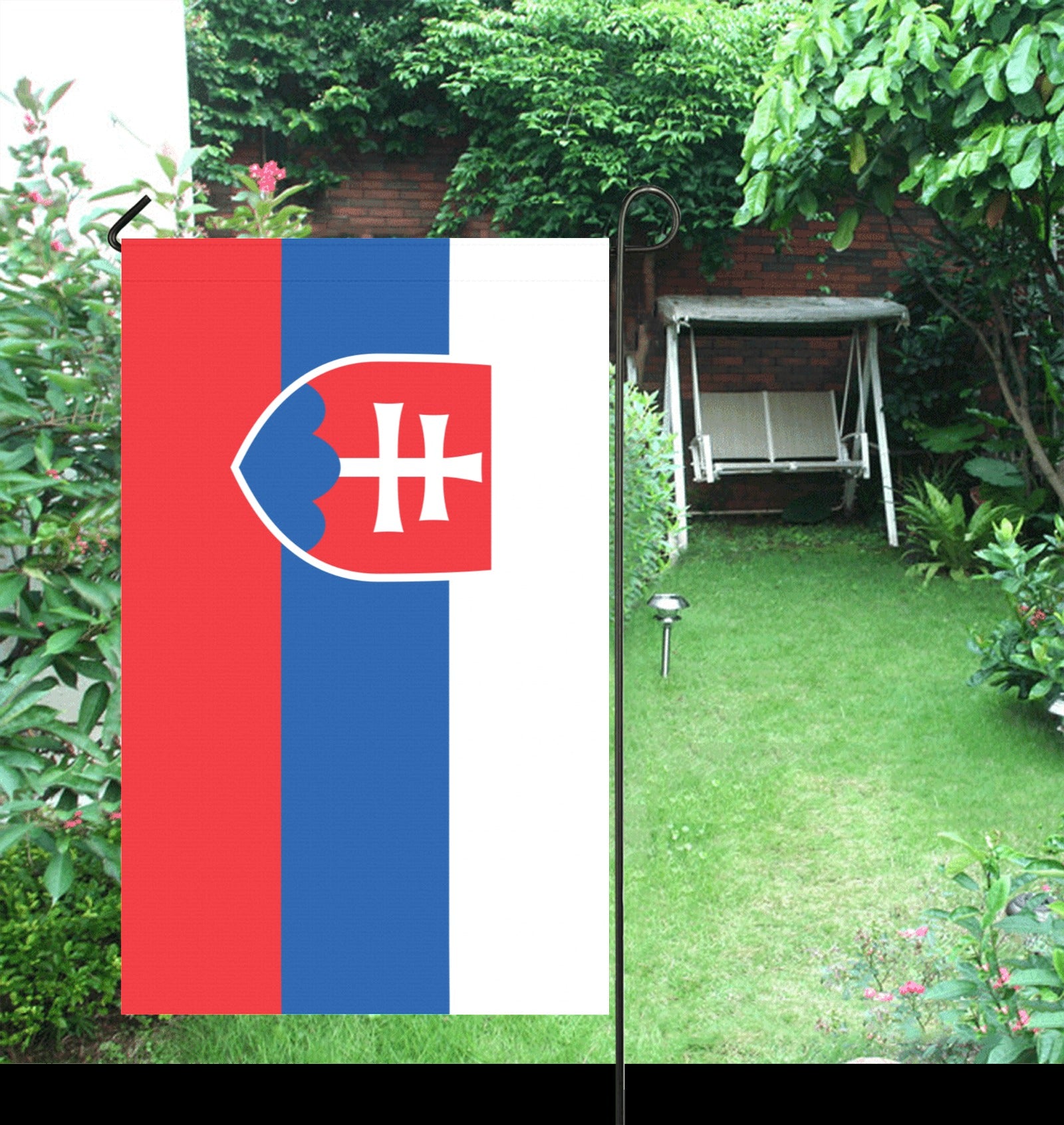 Luv My Flag Slovakia flag in a sunny garden.