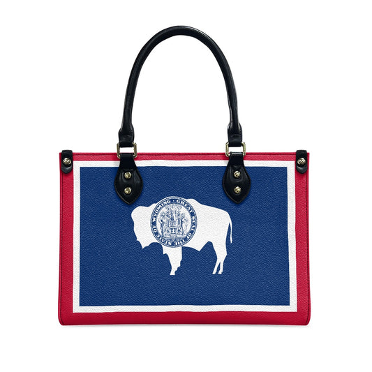 [Brand] handbag featuring Wyoming flag design with buffalo silhouette.