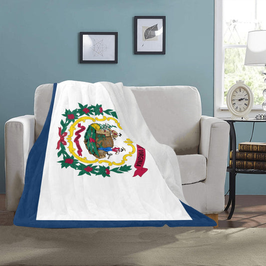 Cozy couch draped with Luv My Flag West Virginia blanket.