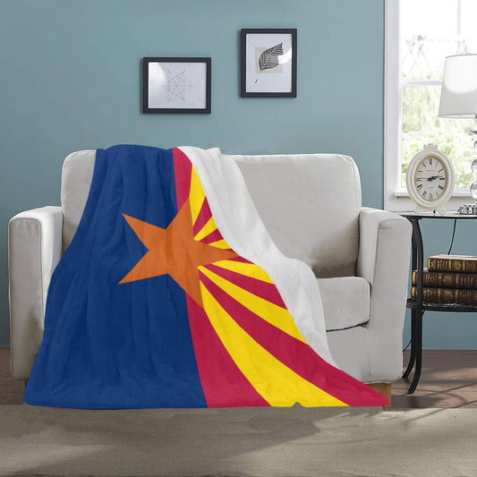Cozy [Luv My Flag] blanket with Arizona flag design draped.