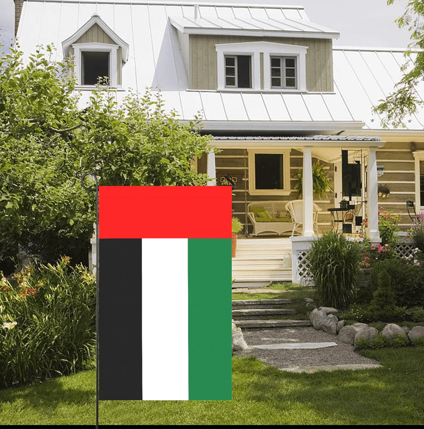Luv My Flag, vertical garden flag beside charming countryside house.