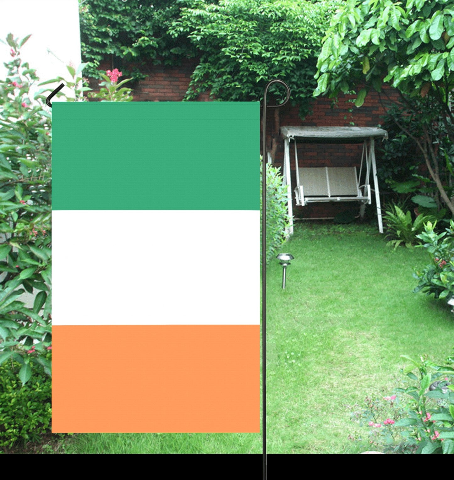 [Luv My Flag] Ireland-themed garden flag in verdant backyard.