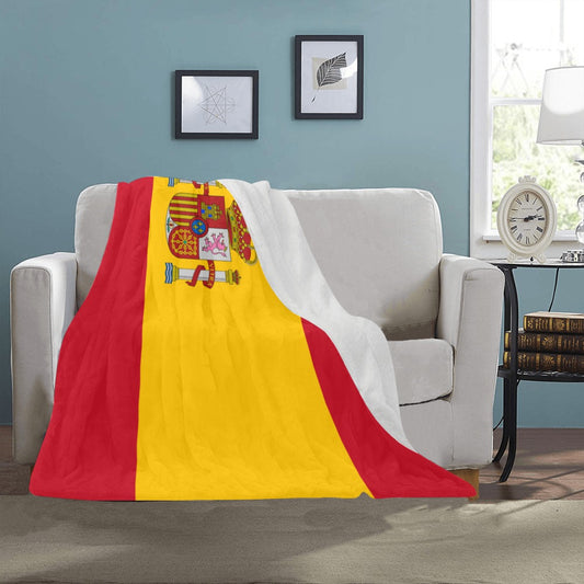 Luv My Flag blanket with Spanish flag on couch.