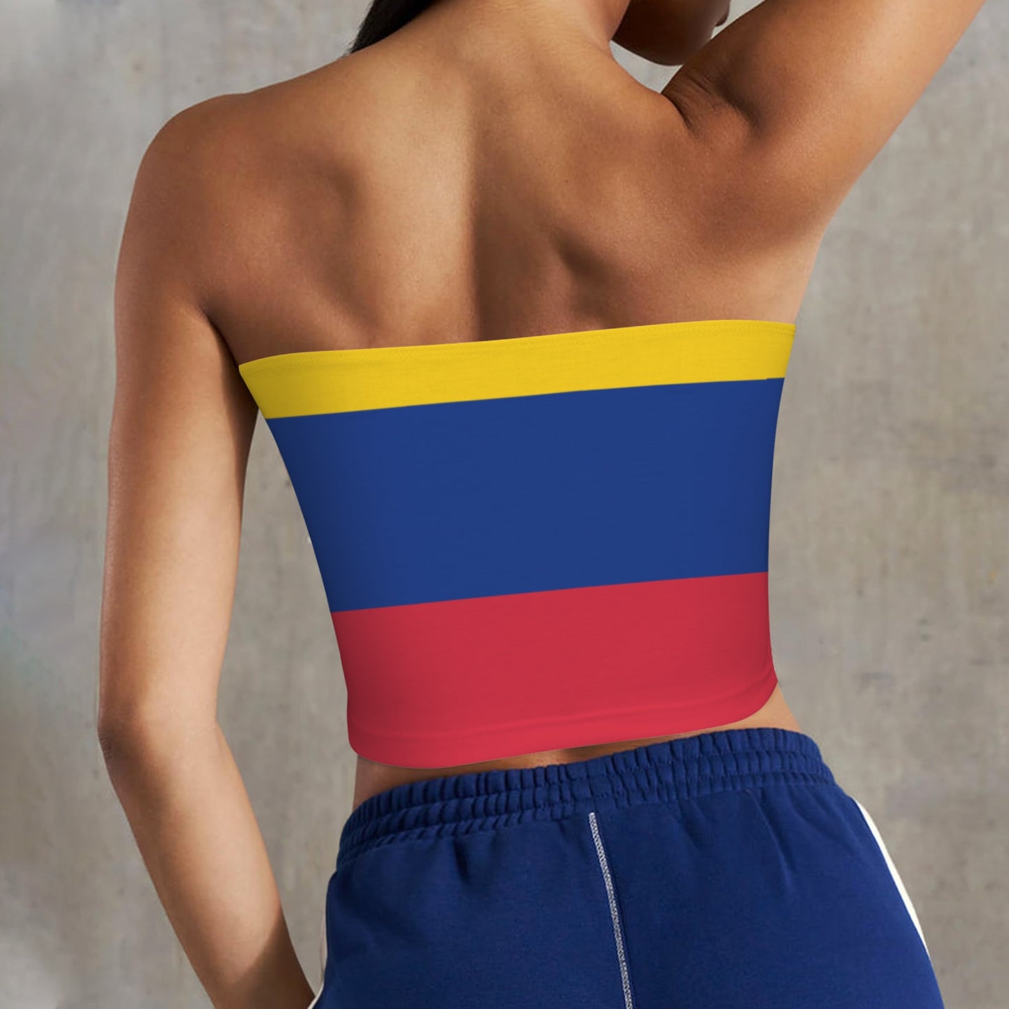 Rear view woman in flag tube top, [Brand] shorts.