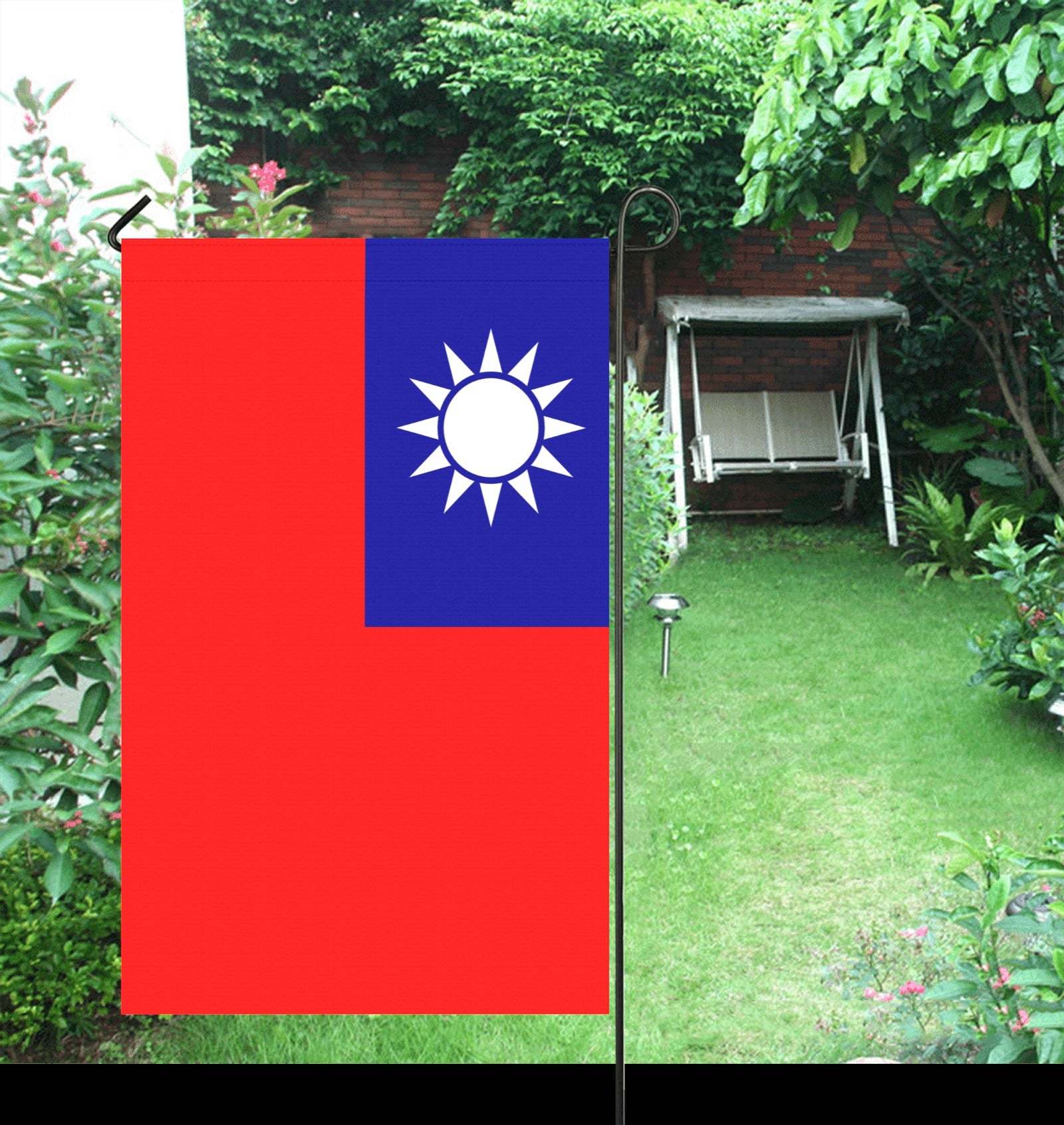 Luv My Flag Taiwanese flag displayed in lush garden.