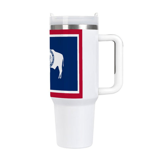 White [Brand] travel mug with Wyoming flag design.