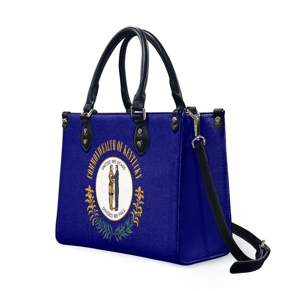 Blue handbag with Kentucky emblem, black straps, [Brand].