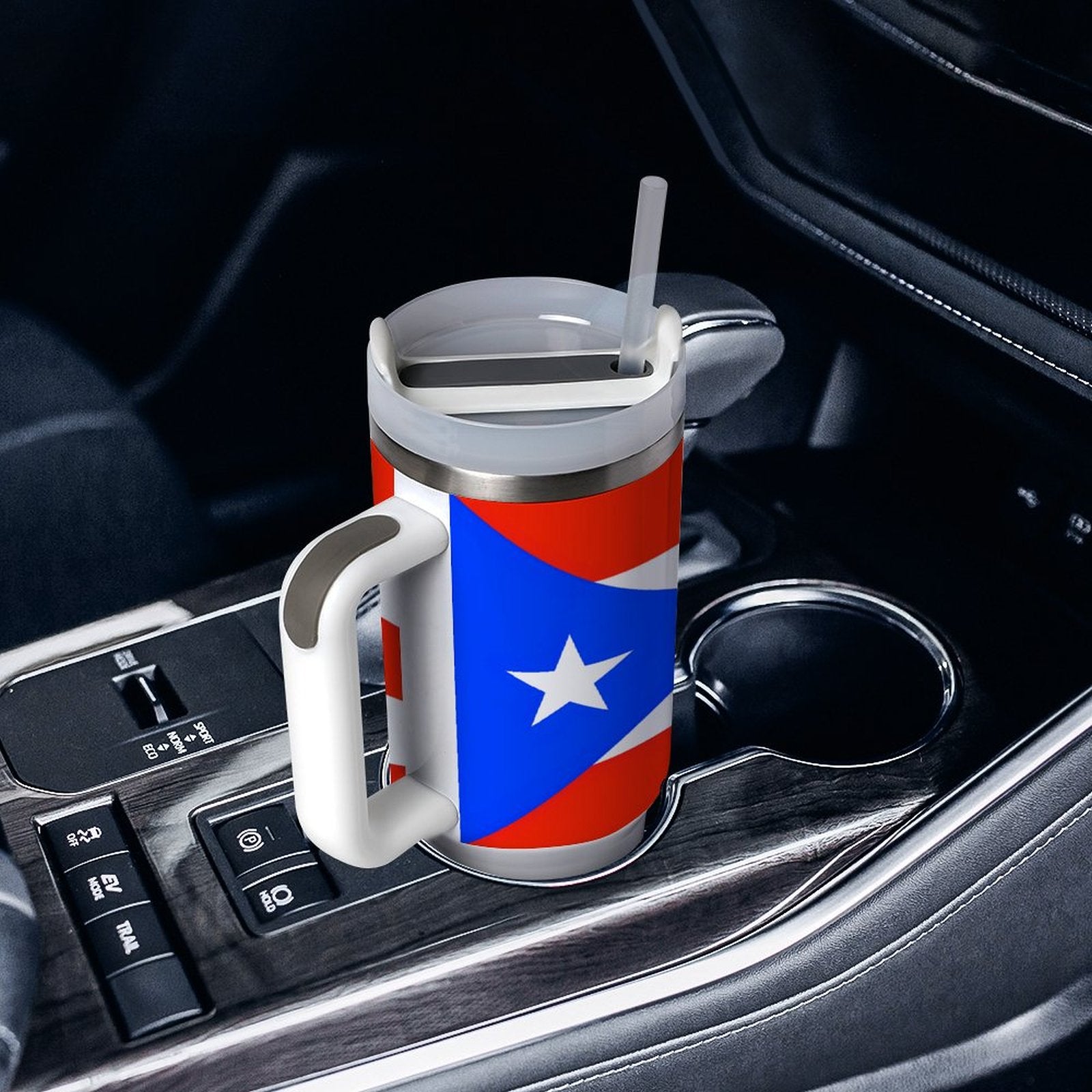 [Brand] travel mug with Puerto Rican flag design in car.