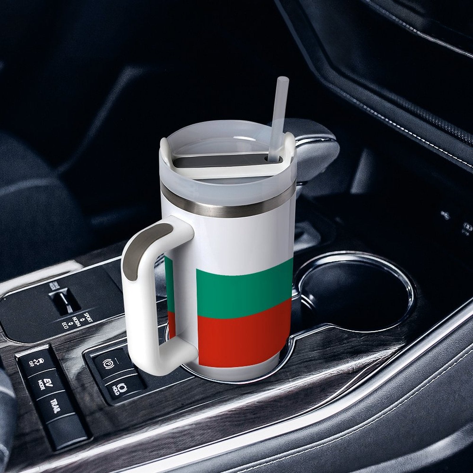 [Brand] mug with red-green stripes in car cup holder.