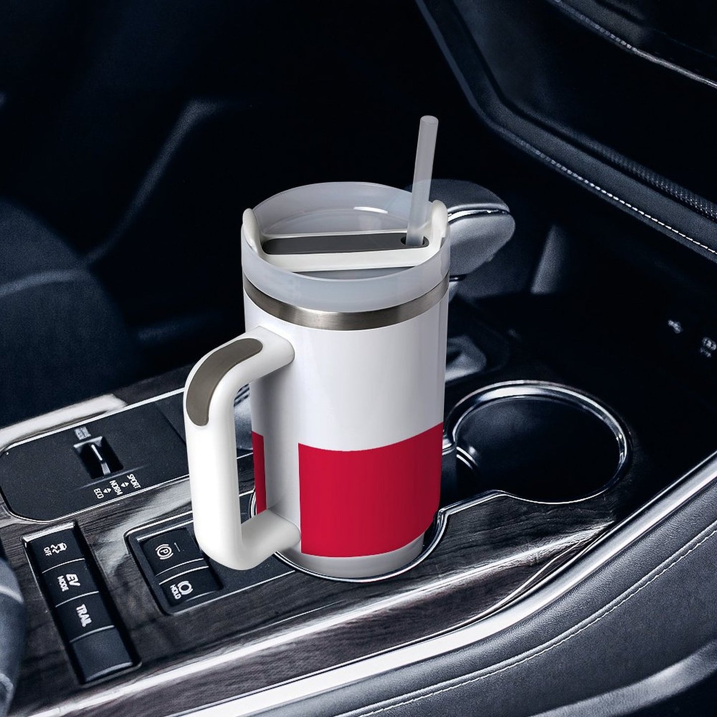 [Brand] insulated mug with handle in a car cupholder.