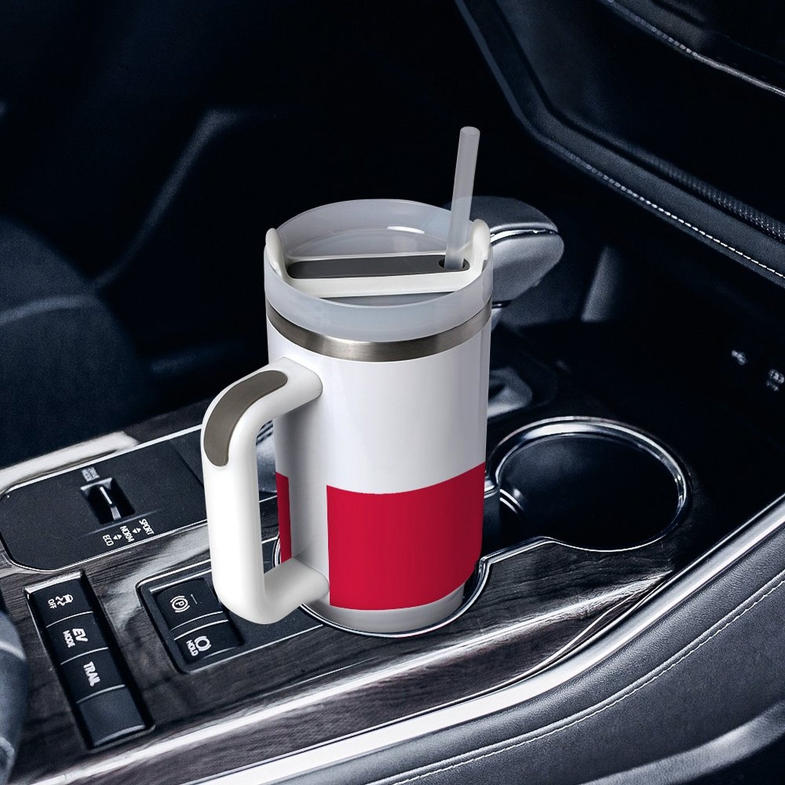 [Brand] insulated mug with handle in a car cupholder.