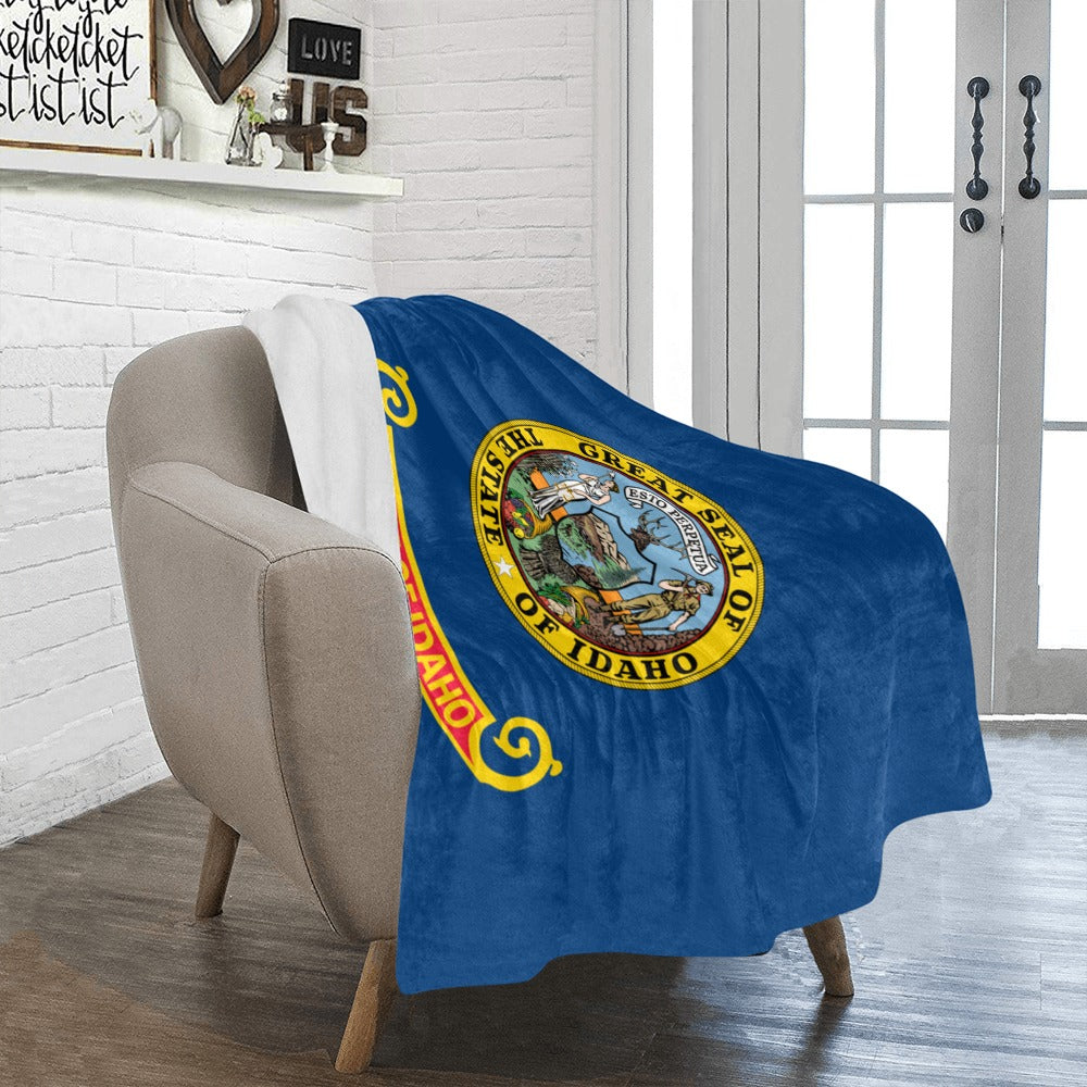 A soft blue throw with Idaho seal, Luv My Flag.