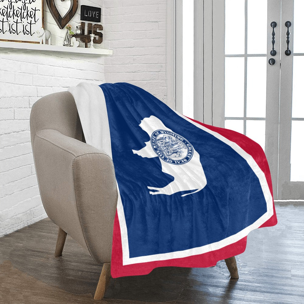 Cozy chair with Luv My Flag themed decorative throw blanket.