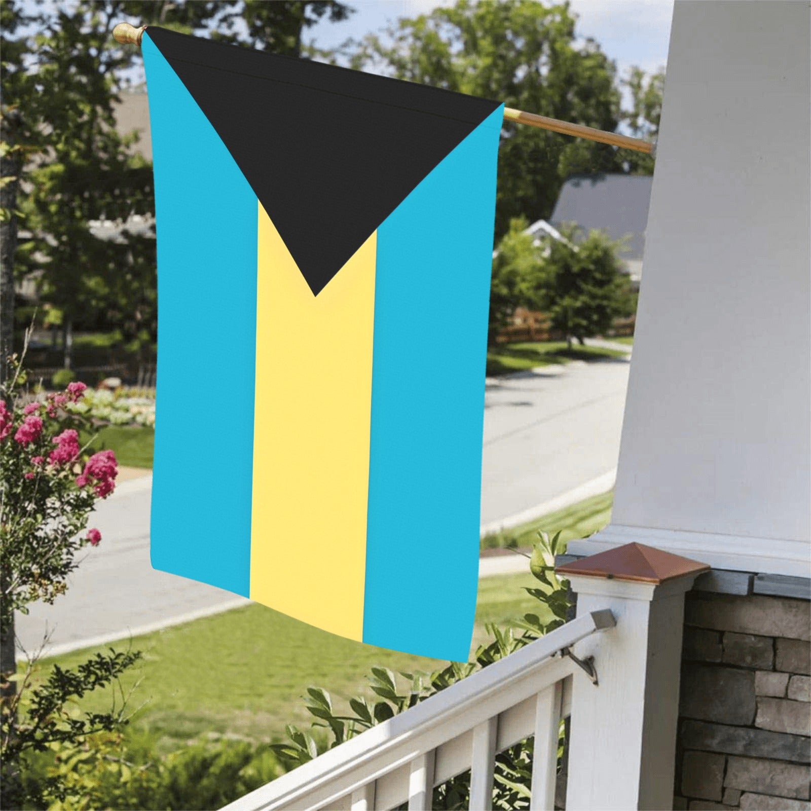 Luv My Flag Bahamian flag hanging on porch railing.
