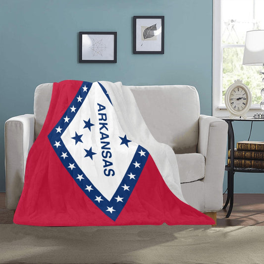 Cozy sofa featuring [Luv My Flag] Arkansas-themed blanket draped.