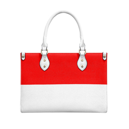 Red and white [Brand] handbag with white handles, sleek design.
