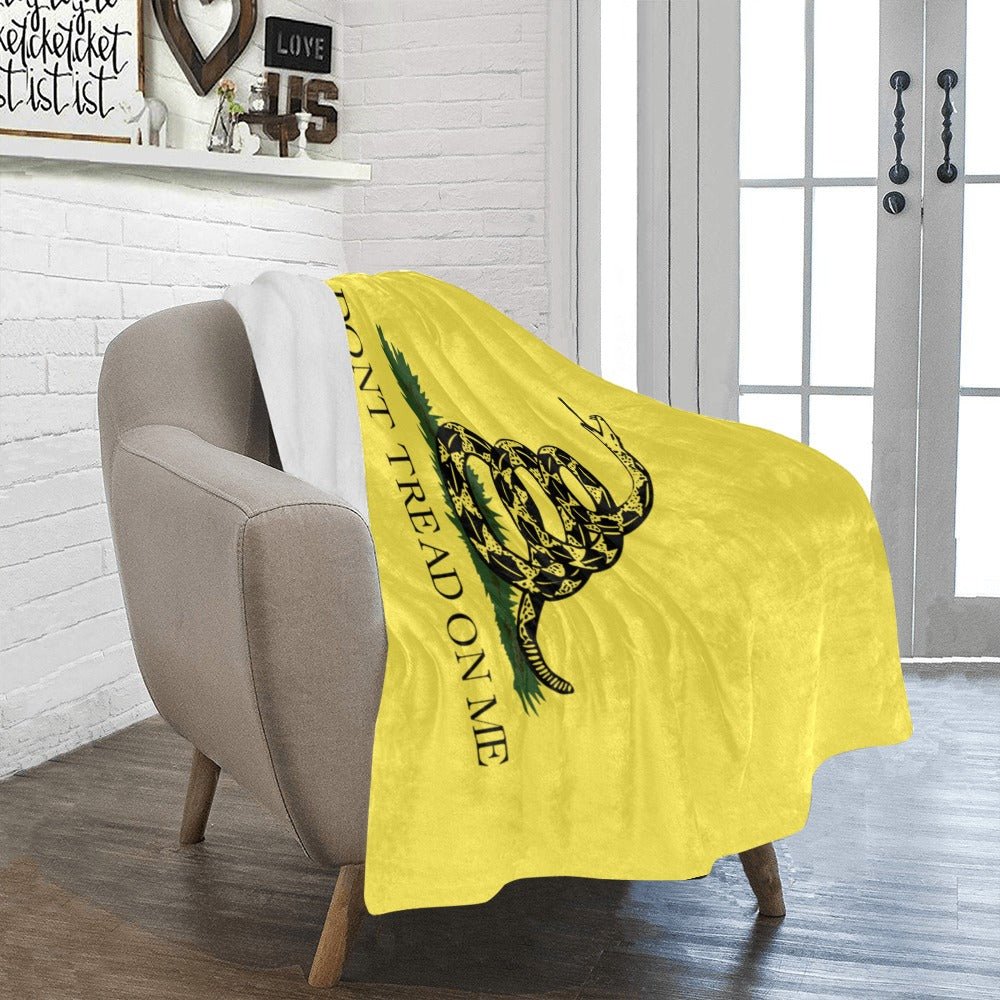[Luv My Flag] blanket featuring a coiled snake design.