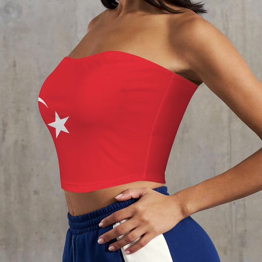 Woman modeling [Brand] red strapless top with white star.