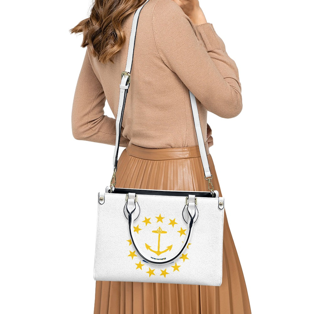 Woman carrying [Brand] handbag with gold anchor design.