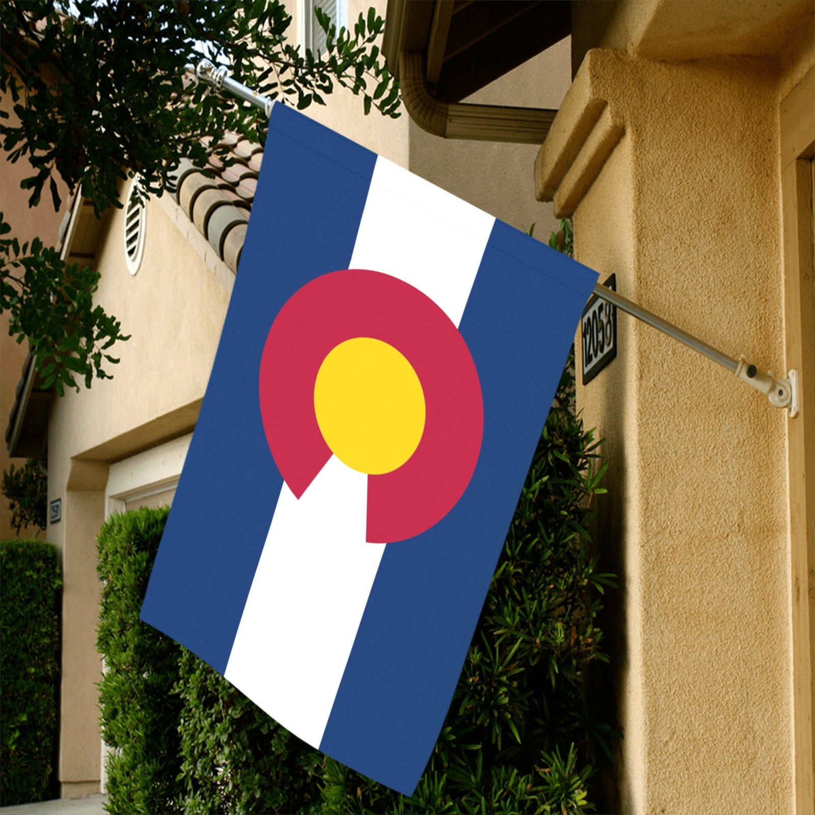 House displaying Luv My Flag Colorado flag outside front door.