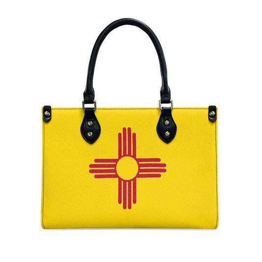 Yellow handbag with Zia symbol design, black handles, [Brand].