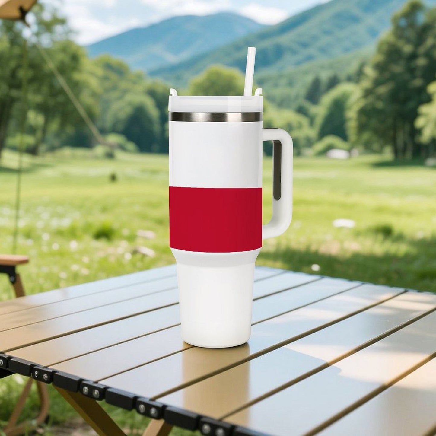 [Brand] tumbler with red stripe on wooden picnic table.