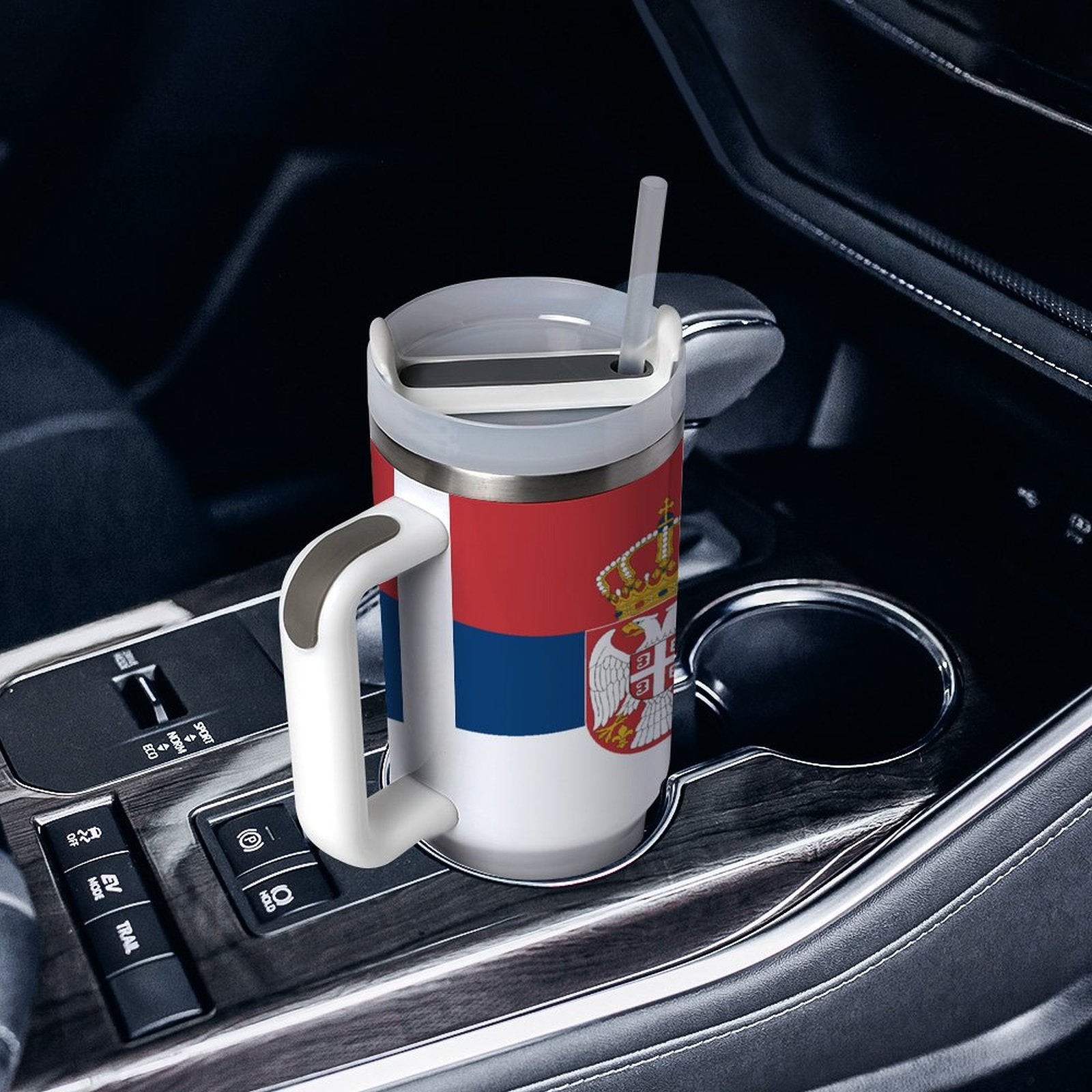 [Brand] travel mug with Serbian flag in car holder.