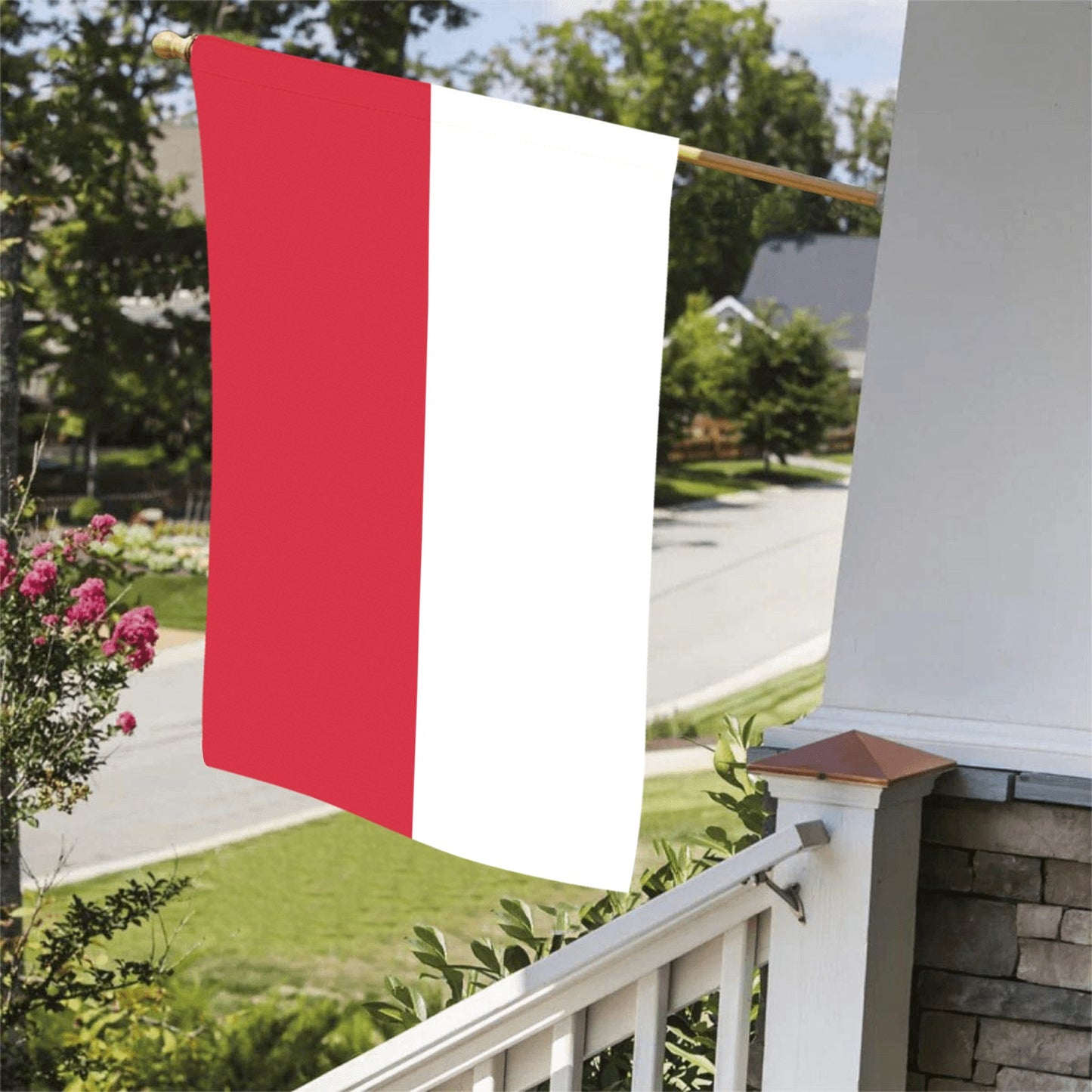 Red and white vertical flag by Luv My Flag outdoors.