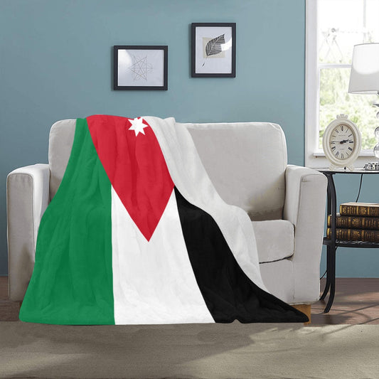 Cozy blanket draped on couch featuring Jordan flag design. Luv My Flag.