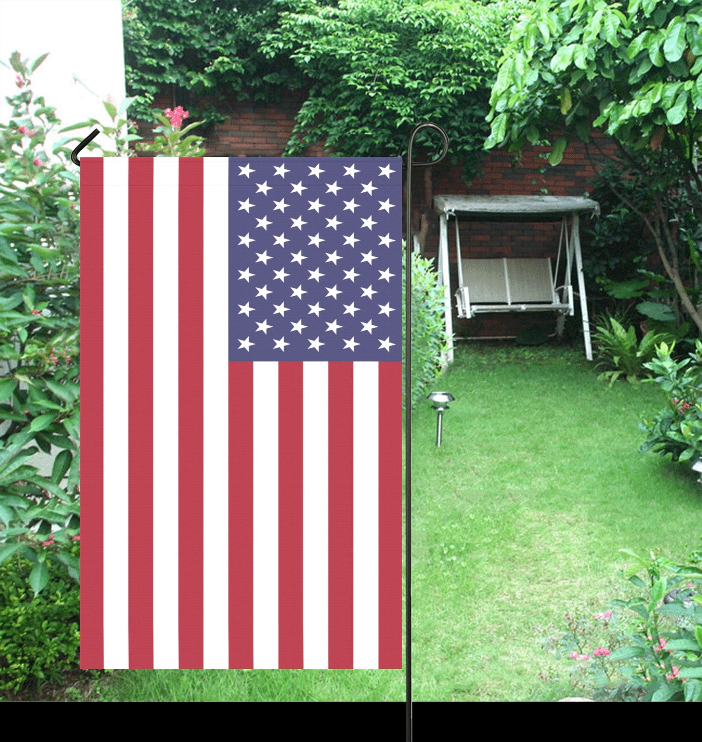 [Luv My Flag] USA flag in a lush garden setting.