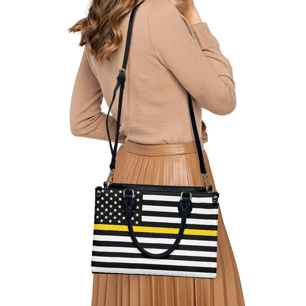 Woman carrying [Brand] bag with American flag design.