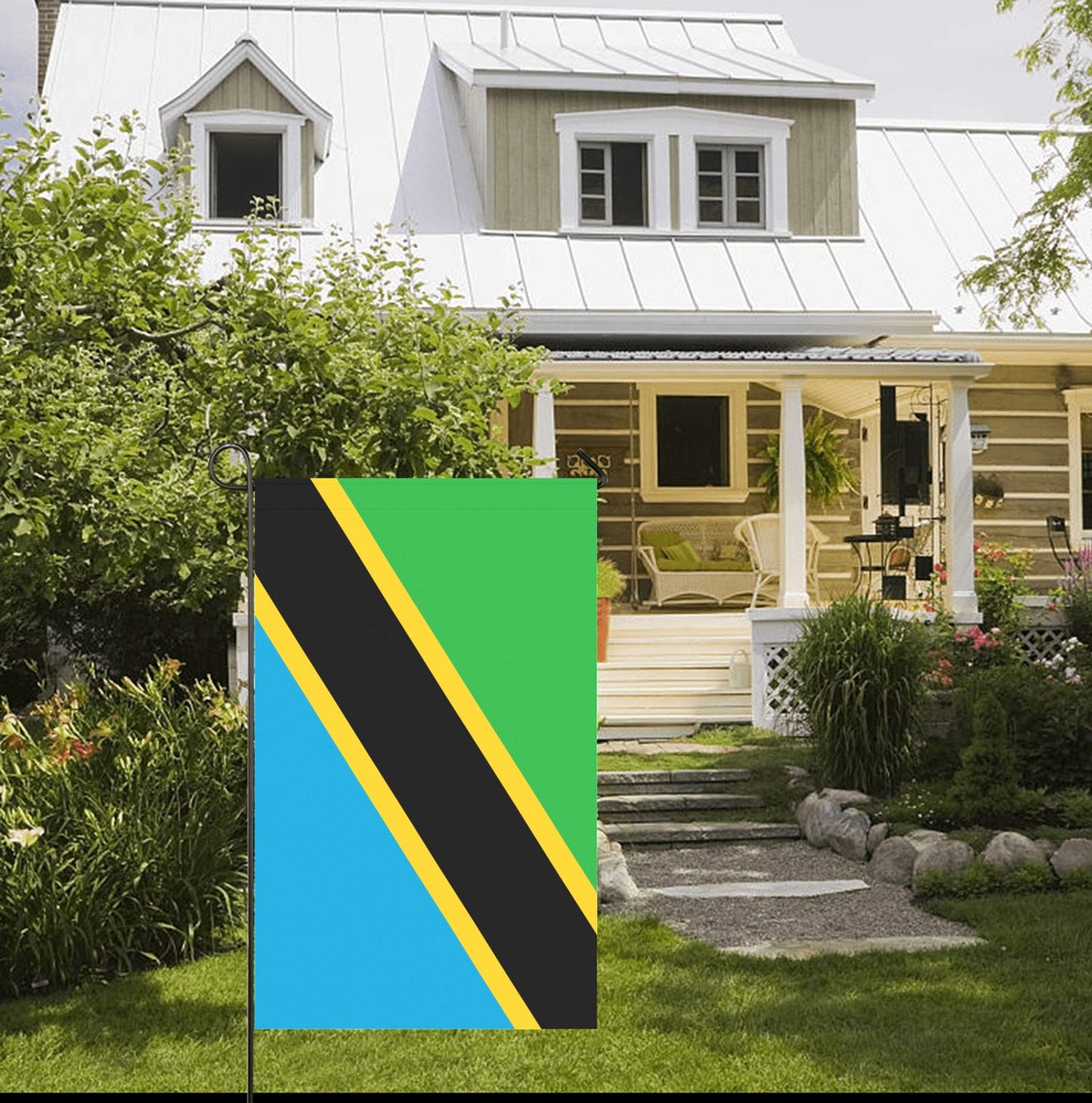 [Luv My Flag] Tanzania flag displayed in charming house garden.