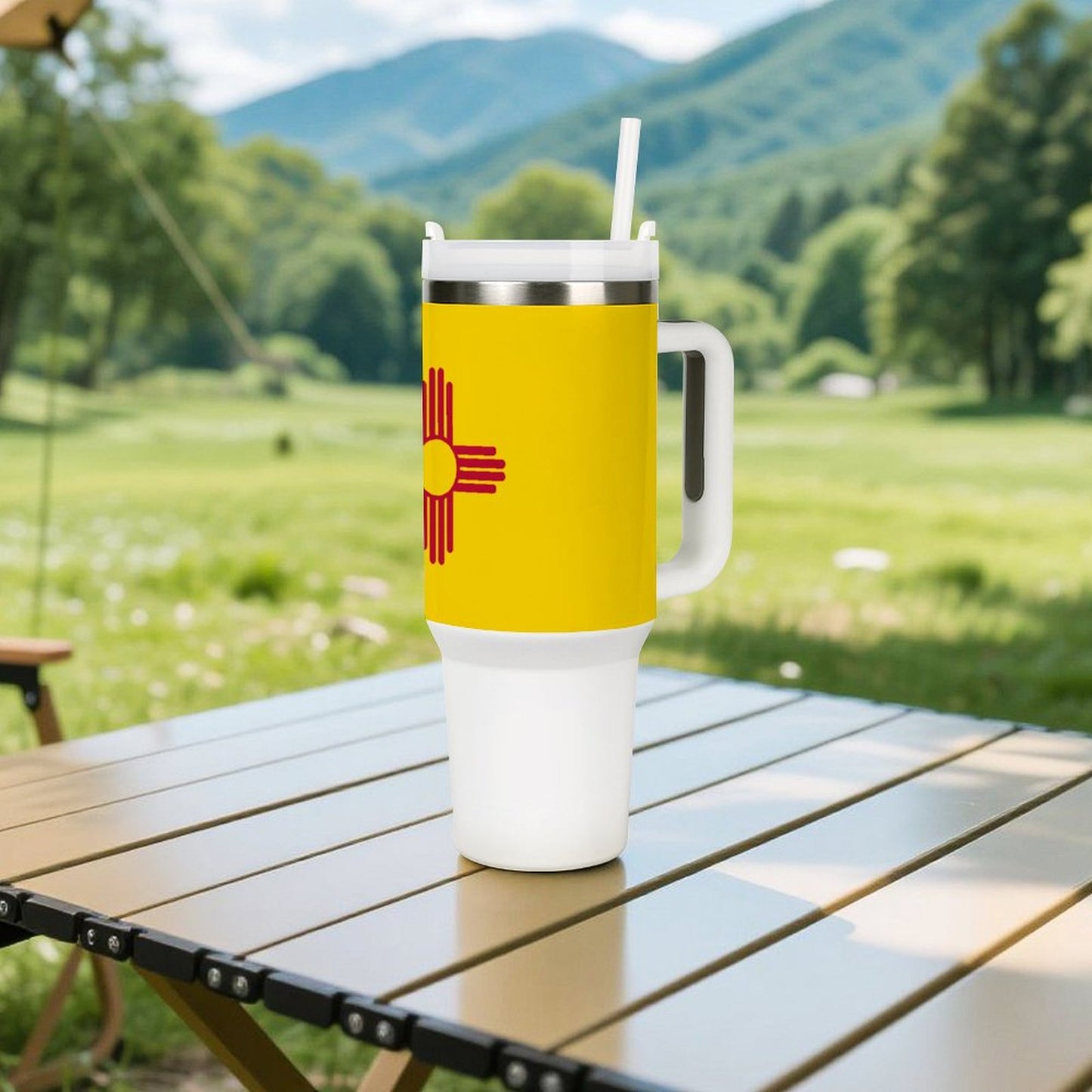 Yellow [Brand] tumbler with handle on table, scenic background.