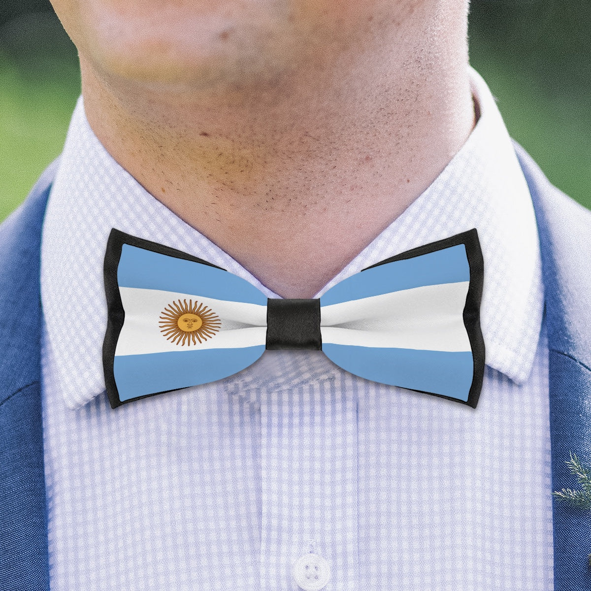 A man wearing [Brand] Argentina flag patterned bow tie.