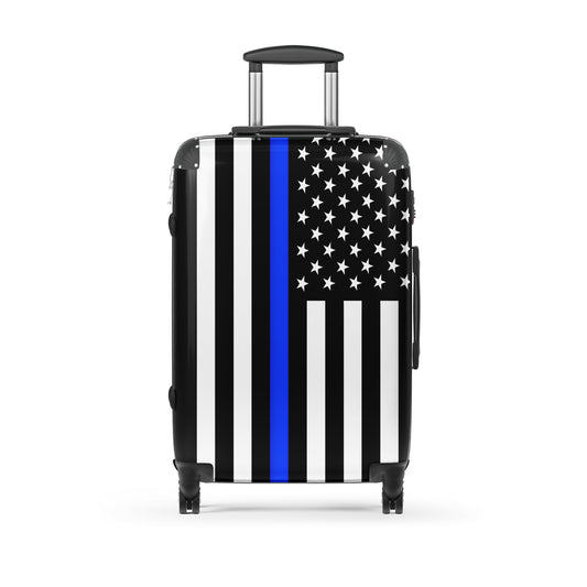 [Brand] suitcase with black, white, blue flag design.