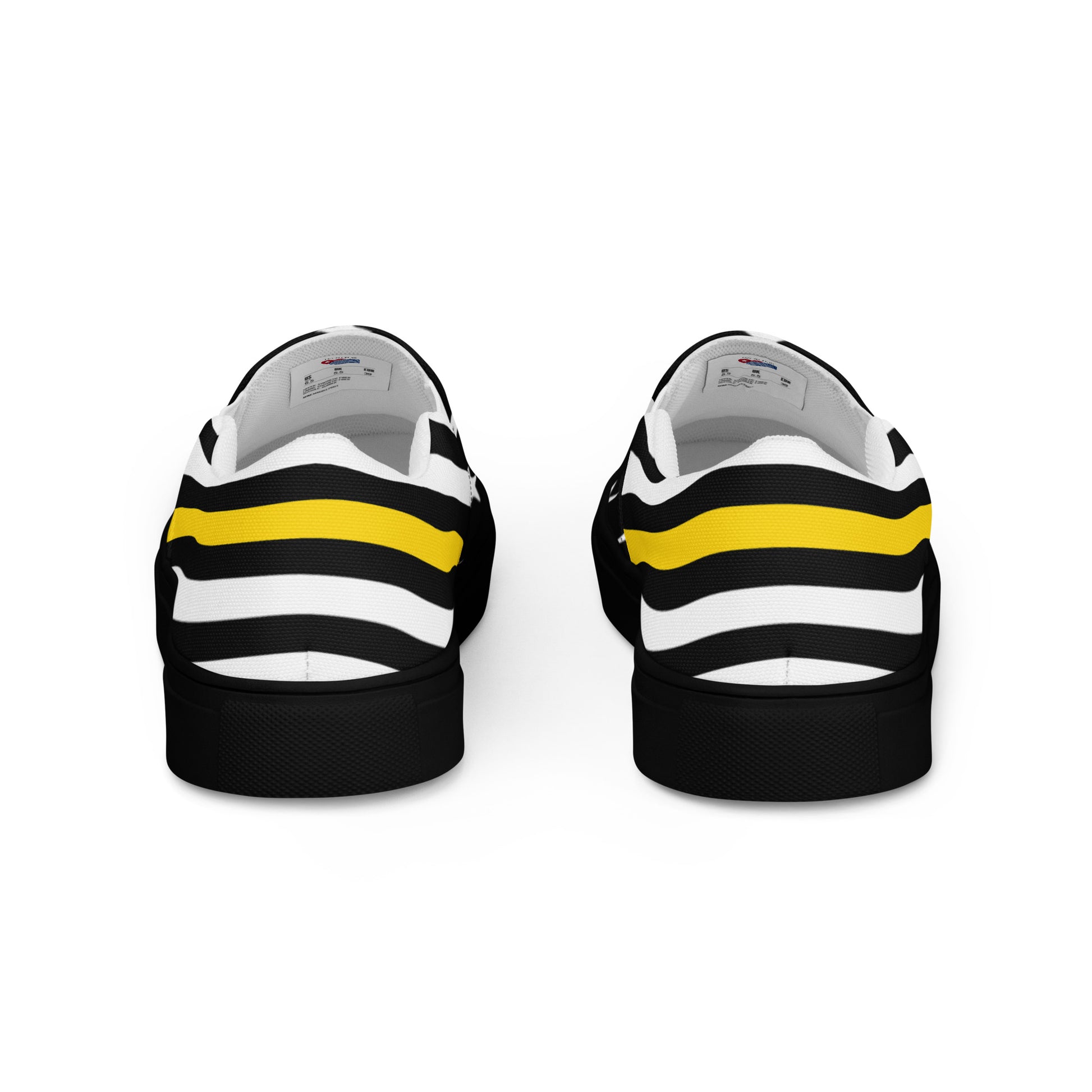 Black and white sneakers with yellow stripe, [Brand].