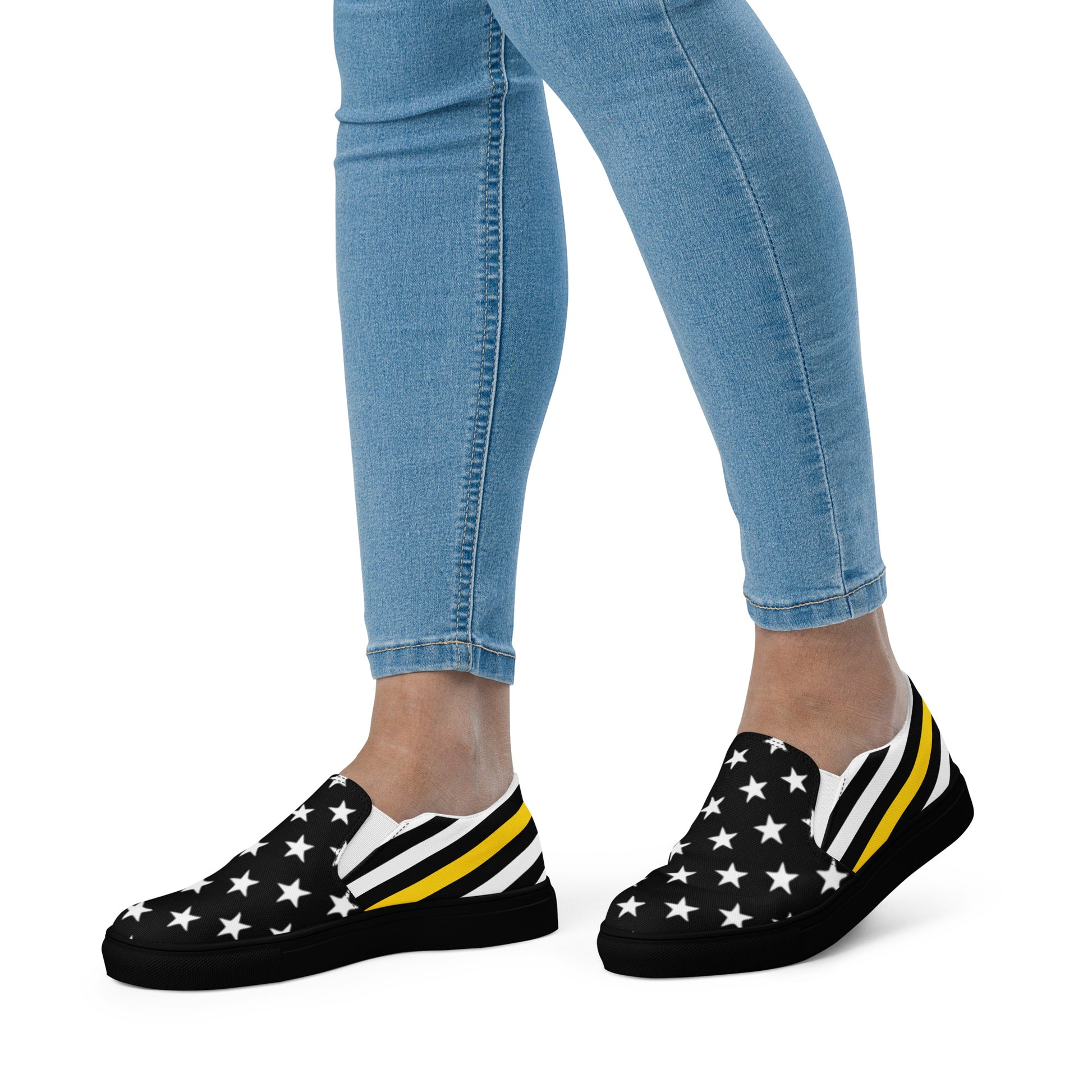 Woman wearing [Brand] shoes with stars and stripes design.
