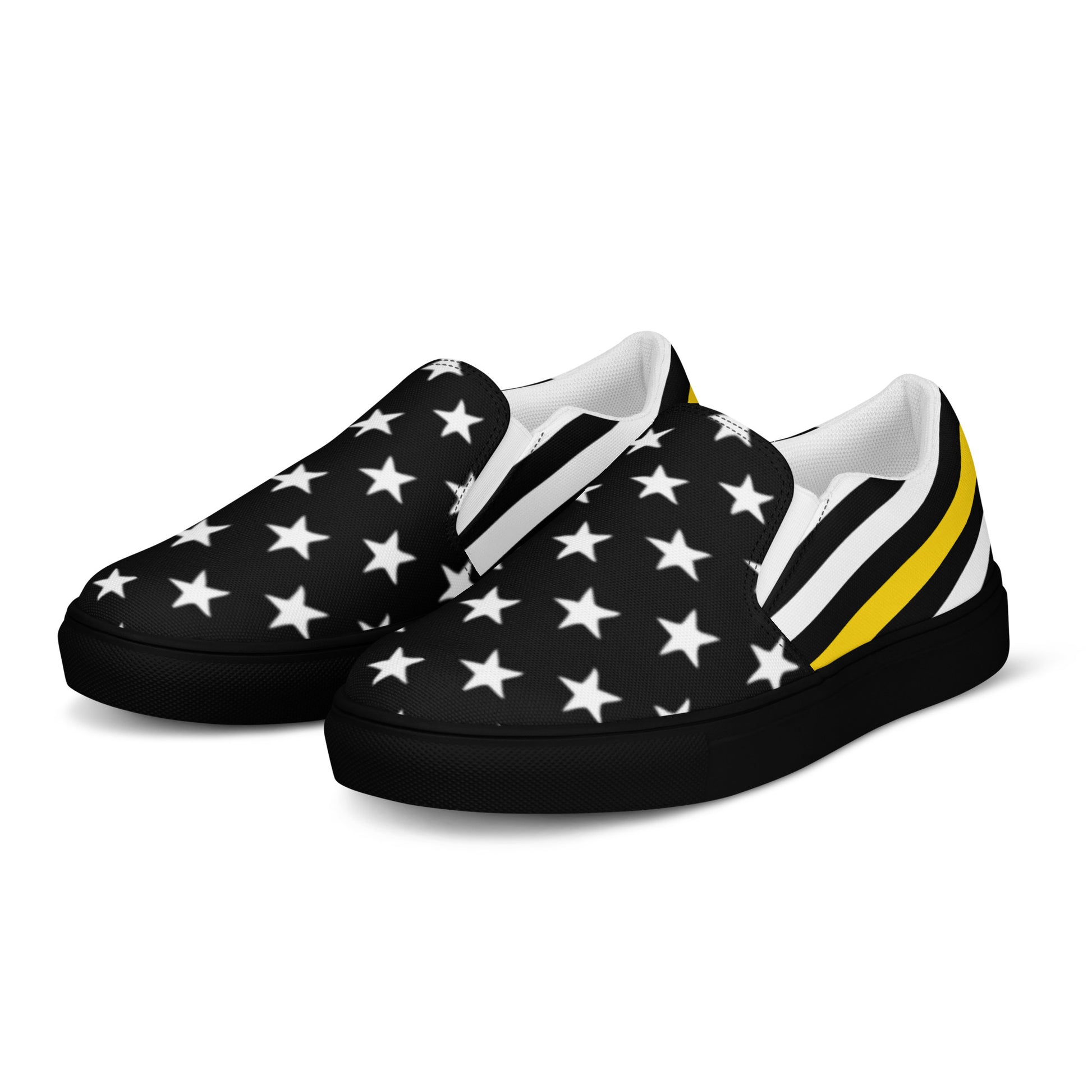 [Brand] slip-on sneakers with black stars, yellow stripes.