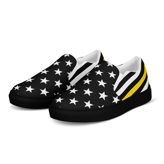 [Brand] slip-on sneakers with black stars, yellow stripes.