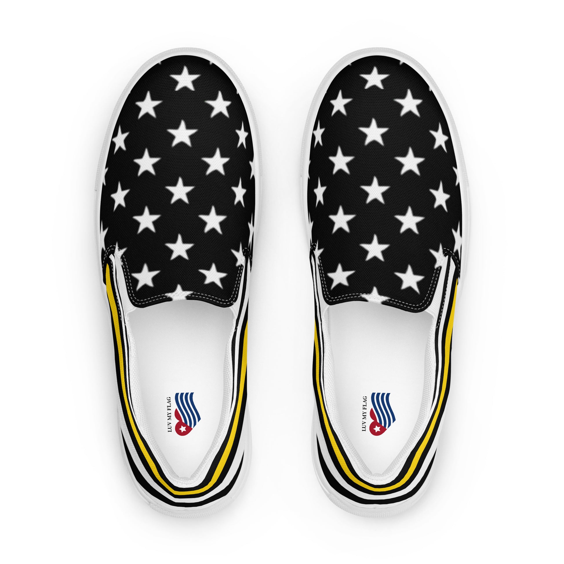 Black slip-on sneakers with white stars, yellow accents. [Brand]